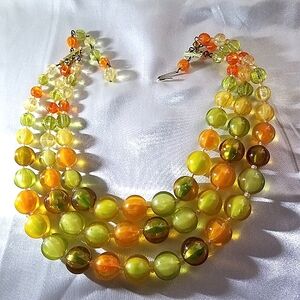 3 strand beaded necklace. Multicolor peach, green, tangerine. Circa 1950s/1960s.